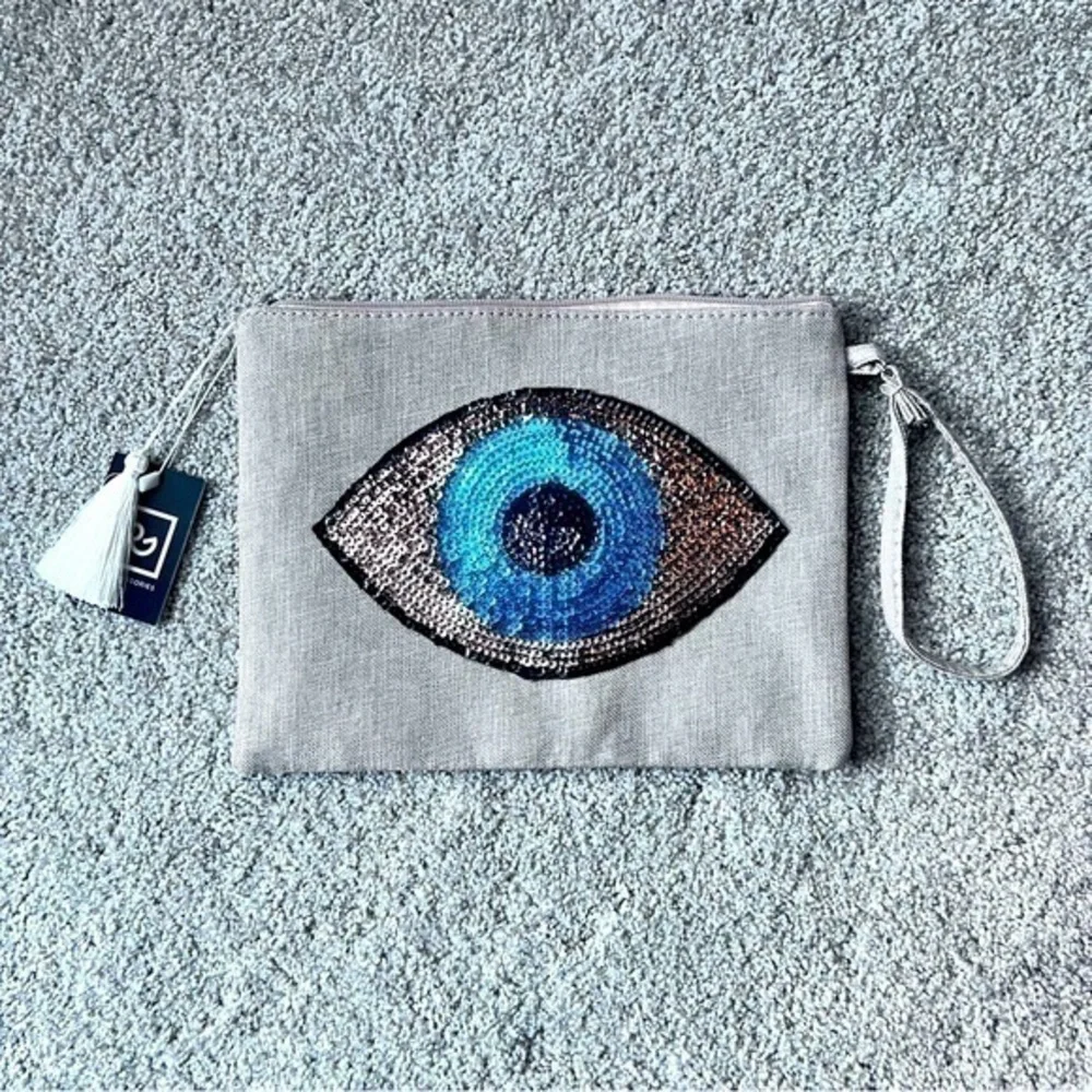 NWT sequin eye zippered pouch with wristlet strap